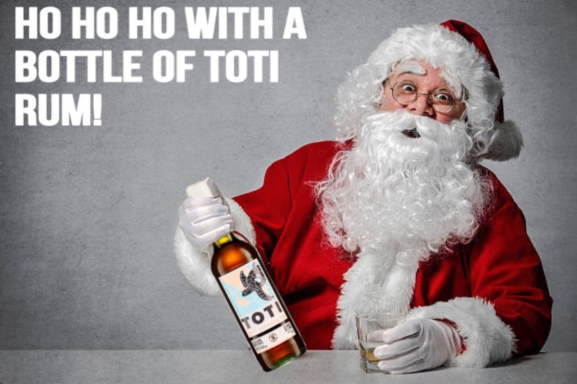 Father Christmas drinking a glass of Tote Rum